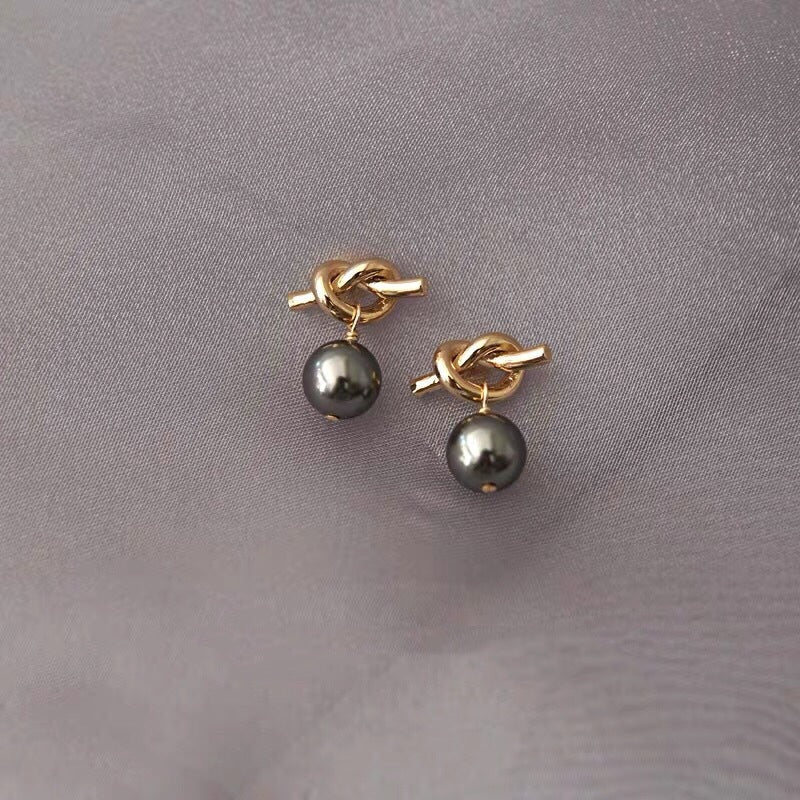 Black pearl knotted earrings