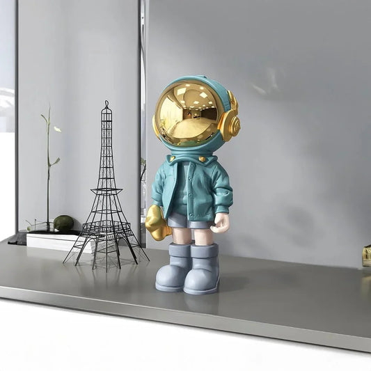 CosmoLuxe – Elegant Astronaut Statue with Gold Accents